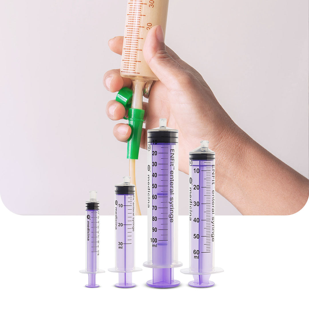 Medisa Feeding Syringes – A set of purple Medicina ENFit enteral syringes in various sizes (10mL, 30mL, 50mL, 60mL) with a demonstration of enteral feeding using a green feeding tube. Safe and accurate enteral nutrition administration