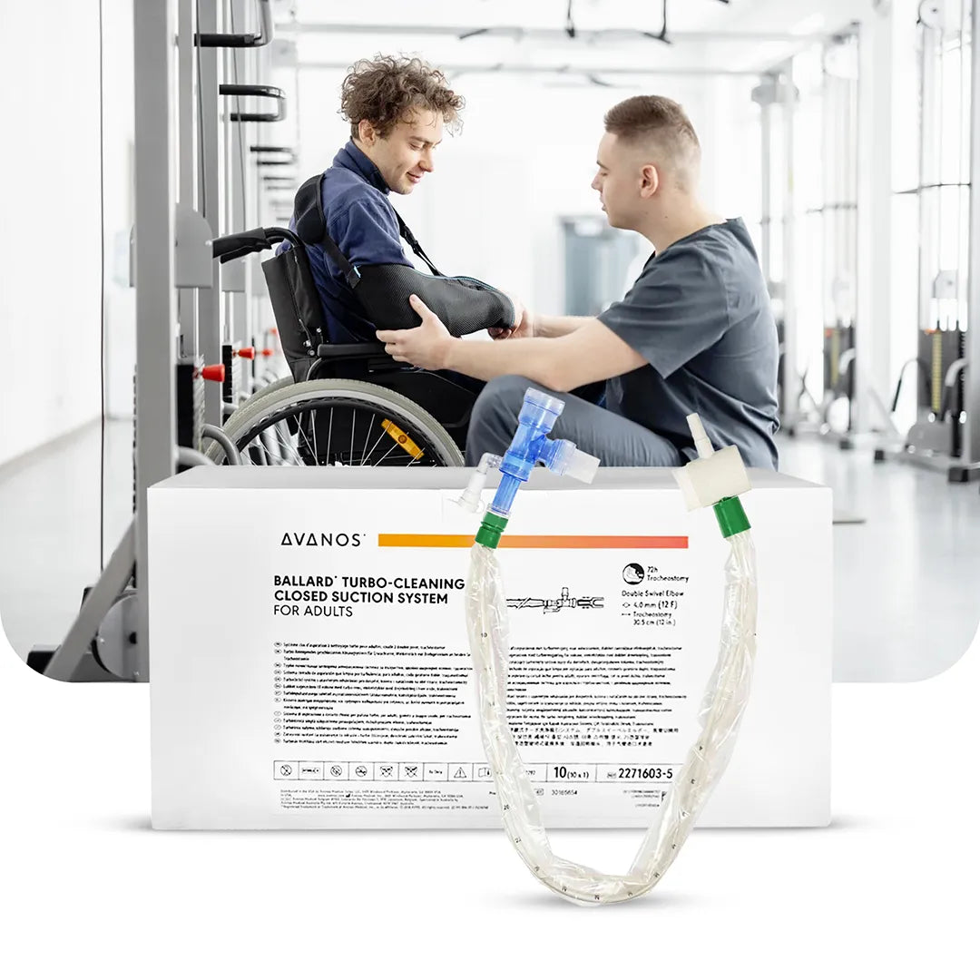 Healthcare professional assisting patient in wheelchair with Avanos BALLARD TURBO Cleaning Closed Suction System for adults displayed in foreground, available at Medisa.