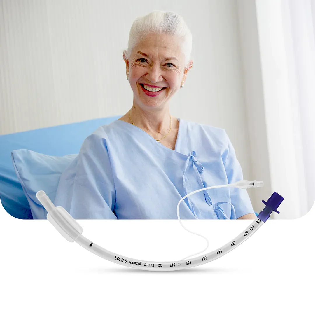 Elderly female patient smiling on a hospital bed beside an Avanos MICROCUFF™ Adult Endotracheal Tube – safe airway management solution.