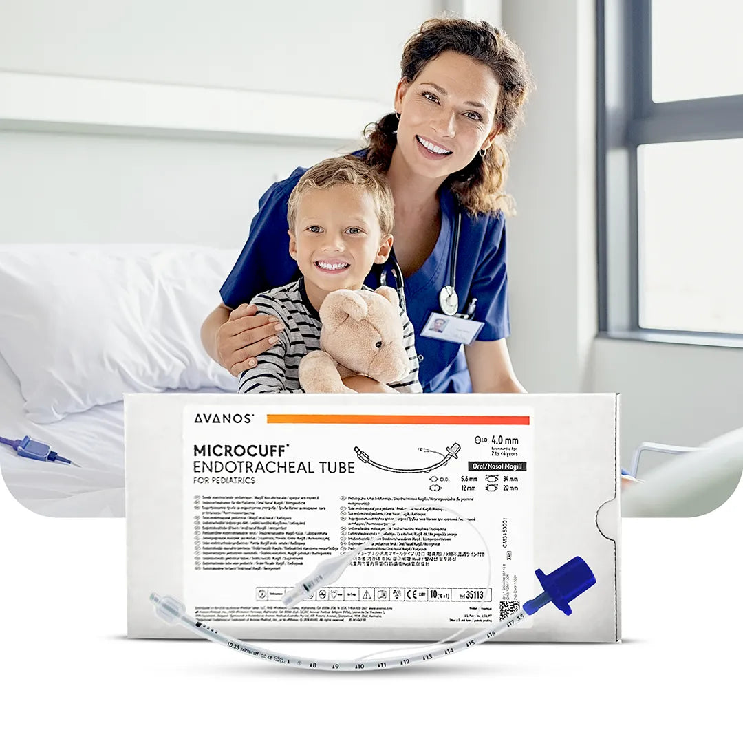 Smiling nurse and child patient holding a teddy bear beside AVANOS MICROCUFF Paediatric Endotracheal Tube packaging, featuring a blue connector and detailed product labeling.