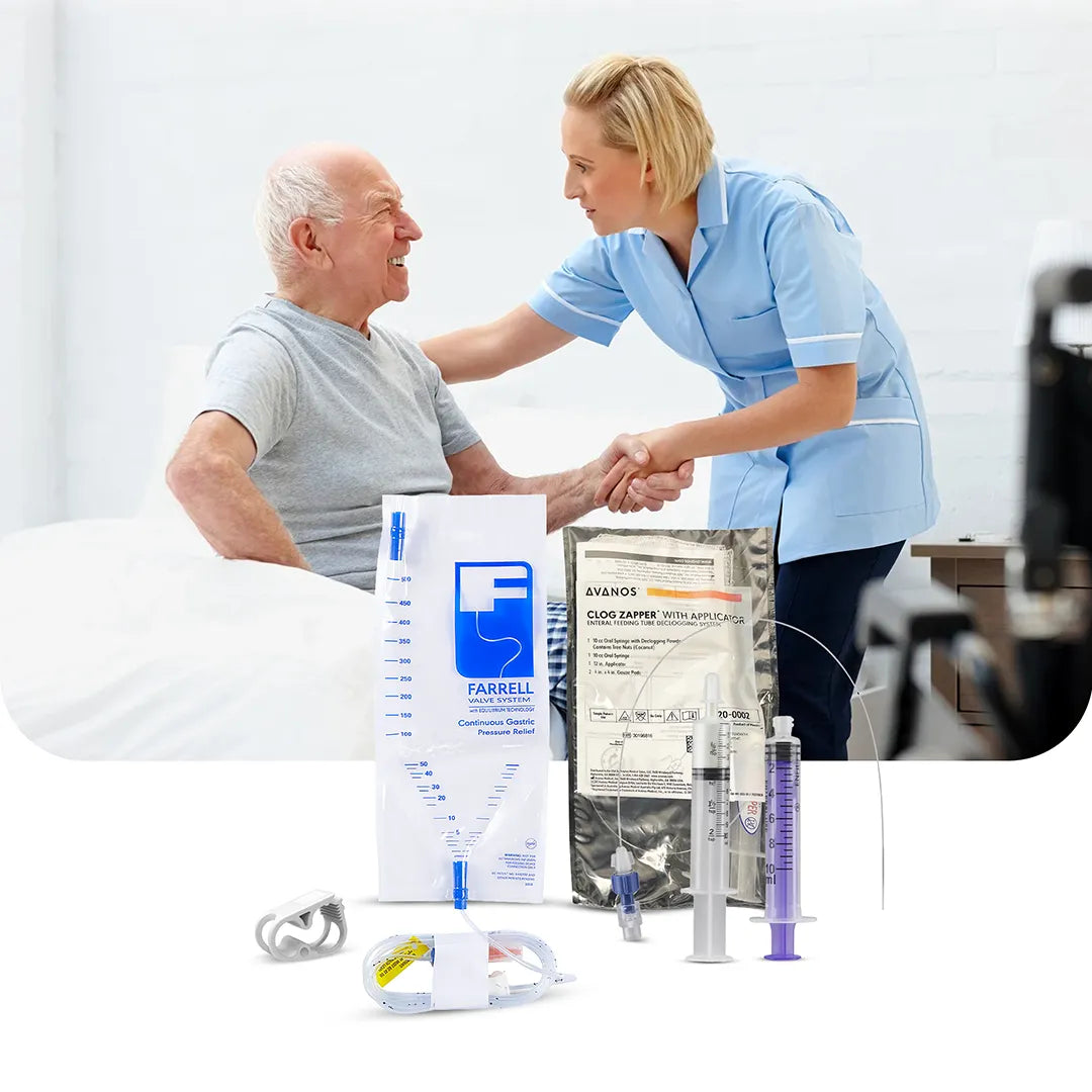 Elderly man in care receiving assistance from a nurse with Farrell Valve System and Avanos Clog Zapper feeding tube accessories displayed in the foreground.