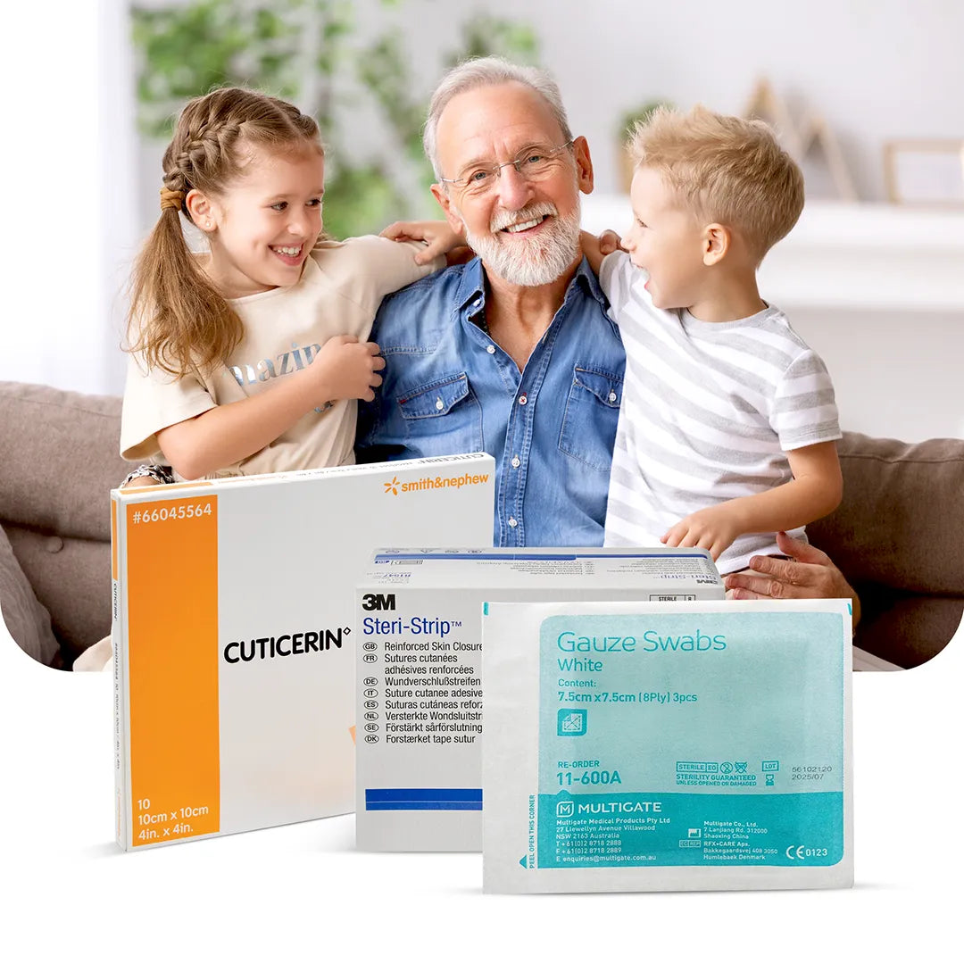 A nurse applies a sterile wound dressing to a patient's arm in a bright medical setting. Steri-Strip and Omnistrip products are displayed in the foreground.