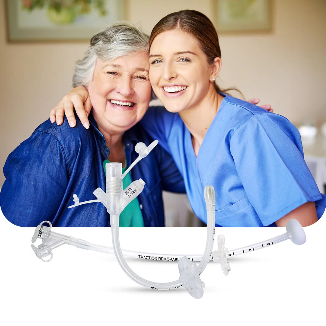 Smiling elderly woman and caregiver embracing, with a gastrostomy feeding tube (G-tube) displayed in the foreground, representing safe enteral nutrition for long-term care.