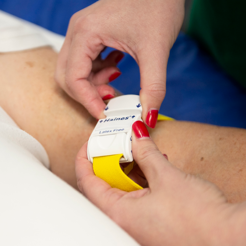 Single Patient Use Tourniquet with white plastic clip for adjustment